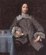 unknow artist Portrait of a gentleman,three-quarter length,standing beside a table painting